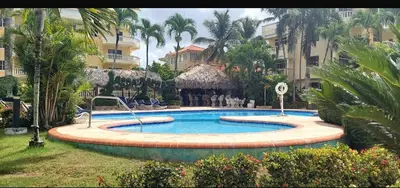 a swimming pool in the middle of a resort at Boca chica retreat in Boca Chica