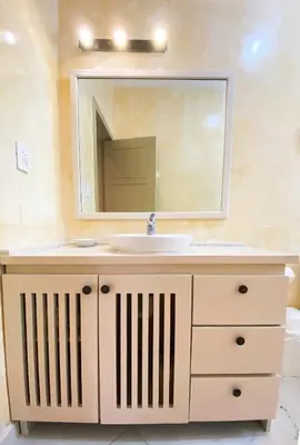 a bathroom with a sink and a mirror at Gorgeous apartment steps to Playa Punta Popy in Las Terrenas