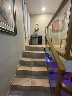 a stairway with a wooden rail and a stair case at Villa Tulum in San Cristóbal