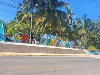 a wall with graffiti on it next to a street at la fenice un apartamento de ensueño en Las Terrenas playa Punta Popy in Las Terrenas
