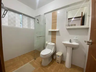 a bathroom with a toilet and a sink at Beach Cabin Juan Dolio in Villas del Mar