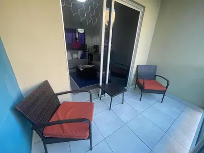 a room with three chairs and a table at Apartamento en Edificio Palmares in La Romana