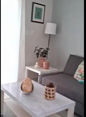 a living room with a couch and a table at Flamingo Villa in Boca Paraiso in Boca Chica