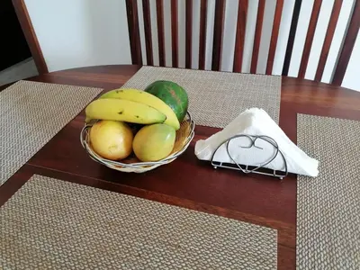 a bowl of fruit on a table with a basket of fruit at Apartment Rozarka Soficu El Edén Dominicus in La Laguna