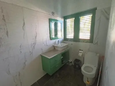 a bathroom with a sink and a toilet at Cozy studio- centre - near beach in Las Terrenas