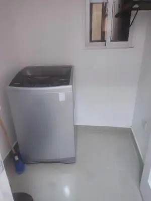 a trash can sitting in a corner of a room at El descanso perfecto in El Cruce