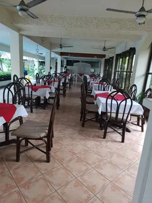 a row of tables and chairs in a restaurant at acuario residencial 2 in La Viva