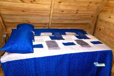 a blue and white bed in a room at VillaSol un descanso en pedernales in Pedernales