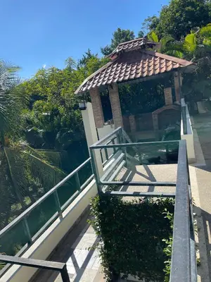 a gazebo on the side of a building at La Cigua in Pedro Brand