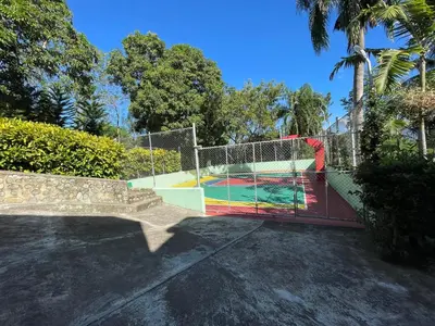 a basketball court with a net in a park at La Cigua in Pedro Brand