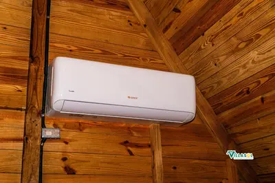 a laptop on the ceiling of a wooden wall at Villasol Pedernales in Pedernales