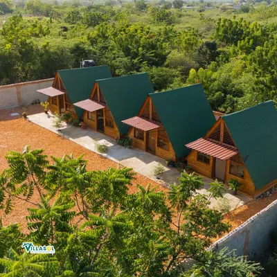 an aerial view of a resort with green roofs at Villasol Pedernales in Pedernales