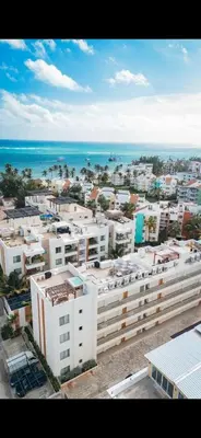 an aerial view of a city with buildings and the ocean at Punta cana apparment close to the beach in Punta Cana