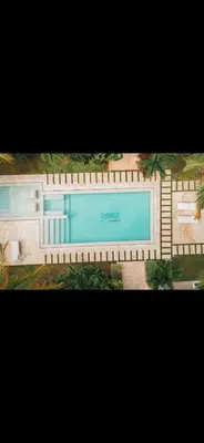 a picture of a swimming pool with a fence at Punta cana apparment close to the beach in Punta Cana