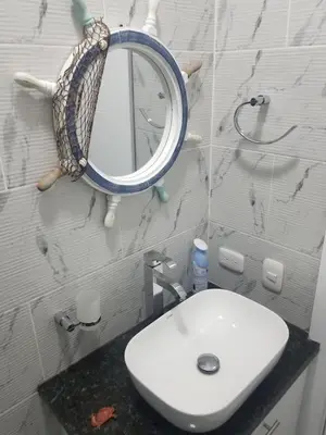 a bathroom with a sink and a mirror on the wall at Vamar Apartamentos in San Felipe de Puerto Plata