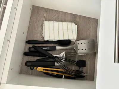 a drawer full of cooking utensils in a box at El Rincon Soleado in San Felipe de Puerto Plata