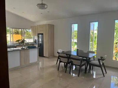 a kitchen and dining room with a table and chairs at Villa Jardín Tropical 2 in Las Galeras