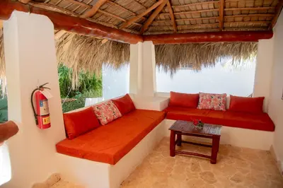 a room with a bench and a table at Paradiso del Caribe Apartments A1 and A2, Your Perfect Stay in Las Galeras in Las Galeras