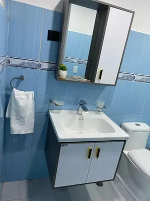 a bathroom with a white sink and a mirror at Apartamento en el Batey de Sosua in Sosúa