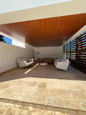 a living room with two chairs and a table at GH Condos by Sunrise3 in Puerto Plata