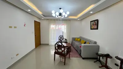 a living room with a couch and a table at AP Filathefia 01 in San Isidro