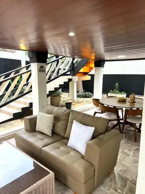 a living room with a couch and a table at Santa's Villa Punta Rucia in Punta Rucia