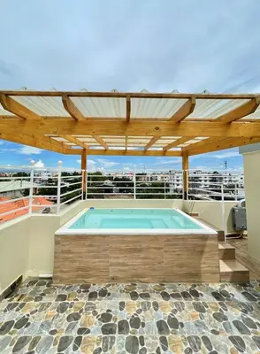 a swimming pool on the roof of a house at 3 bedroom apartment with private jacuzzi and terrace in Ensanche Savica de Mendoza