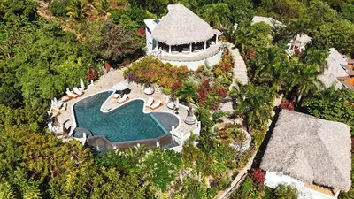 an aerial view of a resort with a swimming pool at Araya Resort in Las Galeras
