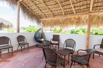 a group of chairs and tables in a room at Villa Retreat in Ibiza, Punta Cana in Punta Cana