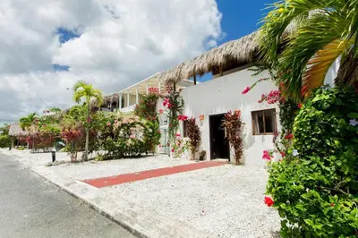 a house with flowers on the side of it at Villa Retreat in Ibiza, Punta Cana in Punta Cana