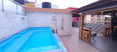 a large swimming pool in a building with at Casa entrada el cachon lucerna in Cancino Adentro