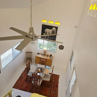 an overhead view of a dining room with a ceiling fan at Villa del sol in Infiernito