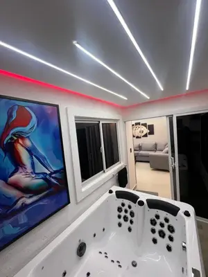 a white bath tub in a room with windows at Apartamento de Lujo in La Estrella