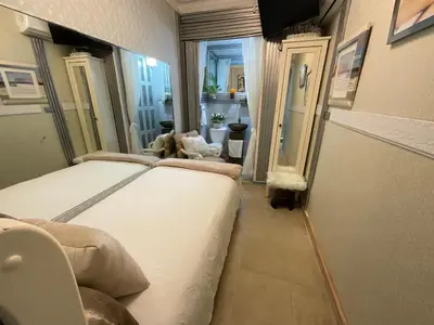 a bedroom with a large bed in a room at Feair in Santo Domingo