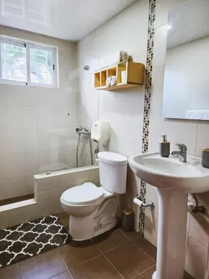 a bathroom with a toilet and a sink at Cozy apartment Marea Azul in La Francia
