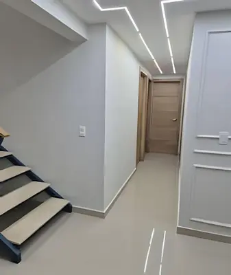 an empty room with a staircase and a door at LD House Luxury Próximo embajada EEUU in Jacagua