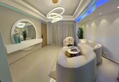 a living room with a white couch and a table at LD House Luxury Próximo embajada EEUU in Jacagua