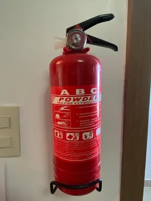 a red fire hydrant is attached to a wall at Cozy retreat with luxurious feel in Santiago de los Caballeros