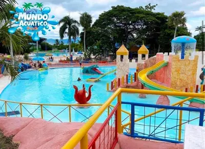 a large pool at a theme park with people in it at Cozy retreat with luxurious feel in Santiago de los Caballeros
