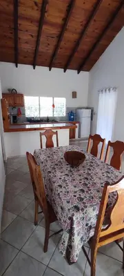 a kitchen with a table and chairs with a table at MOREHomes - Caribe Slow Cost in Las Galeras