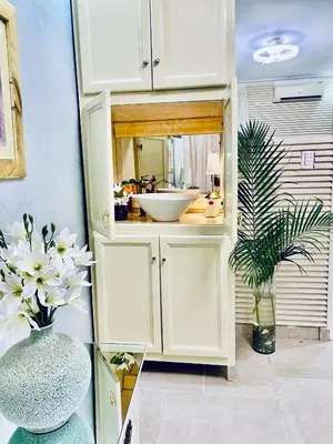 a bathroom with a white sink and a mirror at Jacqueline in Santo Domingo