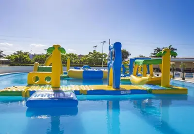 a water park with a water slide in a pool at Villa Tranquila - Sosua Ocean Village in Sosúa