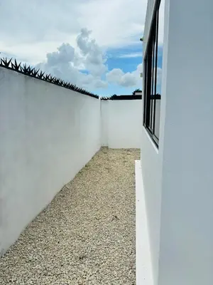 a white fence with a window on top of it at El Rincón Soleado 1 in San Felipe de Puerto Plata