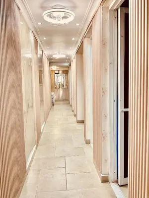 a hallway of a building with a tile floor at Jacqueline in Santo Domingo