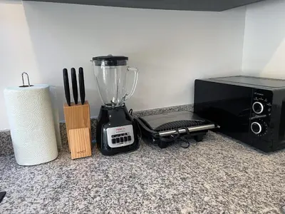 a blender on a counter next to a microwave at Luxury Apt with Private Jacuzzi & Pool Near Beach in Las Terrenas