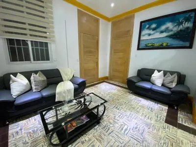 a living room with a couch and a coffee table at Colonial zone 3 bed 3 rooms balcony in Santo Domingo