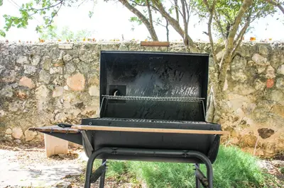 a piano sitting in front of a stone wall at Residencia Bambou HAVRE DE PAIX in Juan Dolio