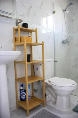 a bathroom with a toilet and a sink at Residencia Bambou HAVRE DE PAIX in Juan Dolio