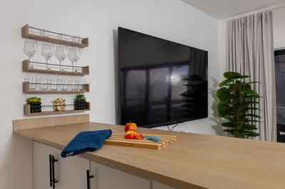 a flat screen tv sitting on top of a table at Serene 2-Bedroom Coastal Retreat in Bayahibe in San Rafael del Yuma