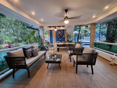 a living room with a couch and chairs and a table at Villa la casita in Villa Altagracia
